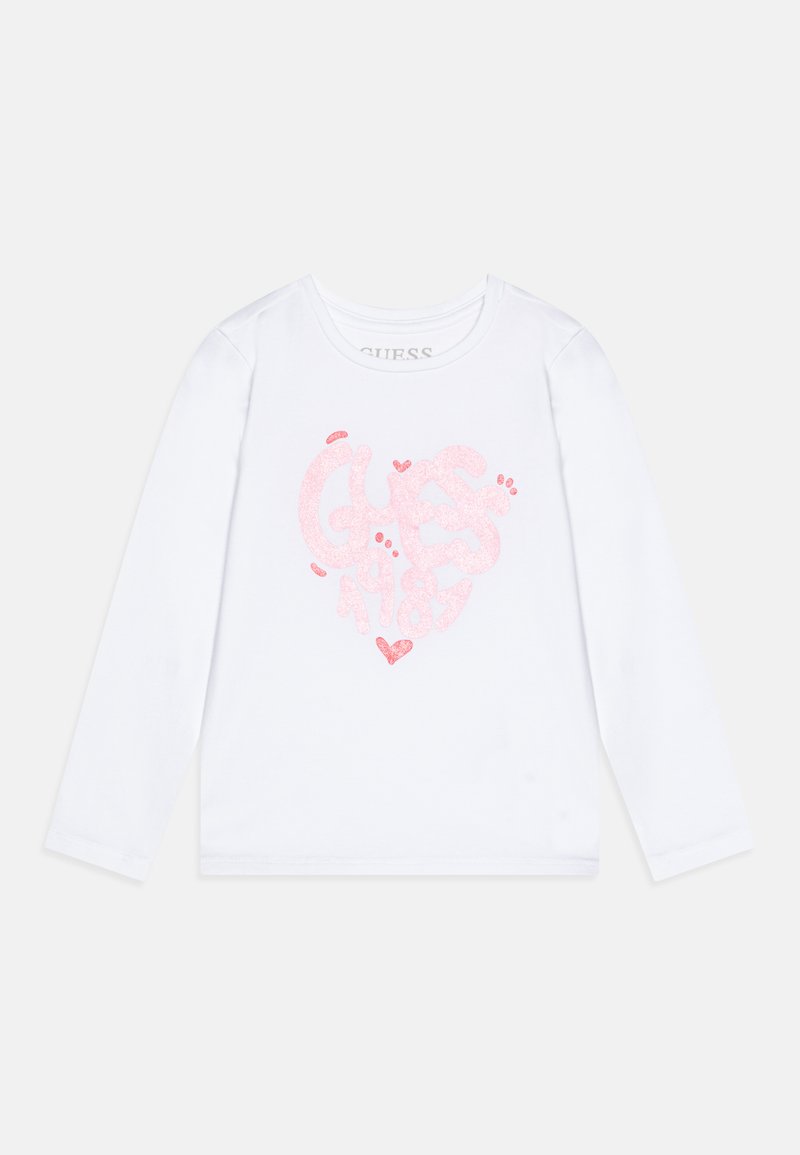 Fehér, hosszú ujjú póló, csillogó rózsaszín szívmintával, rajta a "GUESS" és "1981" felirat, kerek nyakkal, puha anyagú textúrával.