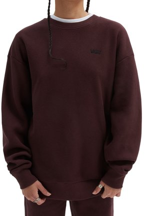 Sweatshirt bordeaux en tissu texturé. Doté d'un col rond et de poignets côtelés. Logo affiché sur la poitrine. Design ample.
