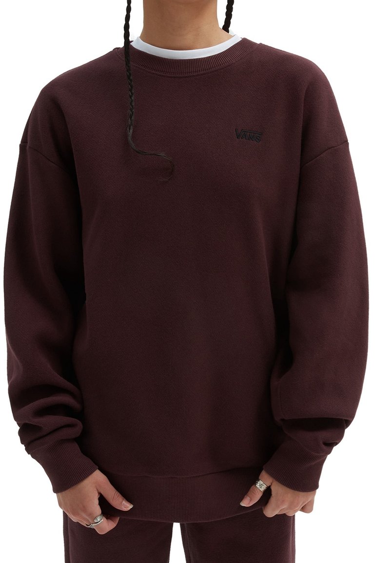 Sudadera burdeos hecha de un tejido texturizado. Presenta un cuello redondo y puños acanalados. Logo exhibido en el pecho. Diseño holgado.