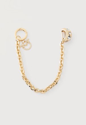 Accessoire de chaîne en or avec un petit pendentif circulaire orné de cristaux à une extrémité et un fermoir décoré de cristaux clairs à l'autre extrémité.