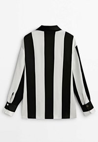 Chemise à manches longues avec des rayures verticales noires et blanches, poignets boutonnés et col, vue de dos sur fond blanc.