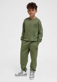 Hummel CLEAN ADJUSTABLE - Trainingsbroek - olivine