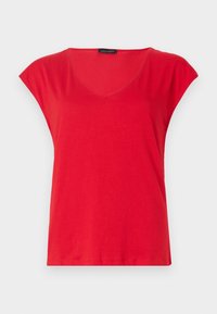 Röd kortärmad T-shirt med V-hals, lös passform och en liten svart etikett på insidan av halsringningen.