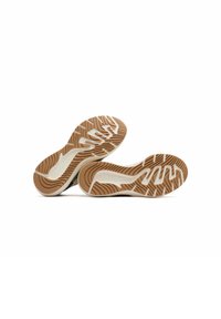 Atletiek schoenen met een gestructureerde beige rubberen zool, met een golfpatroon en witte accenten. Glad zwarte tussenzool. Geschikt voor actieve gebruiken.