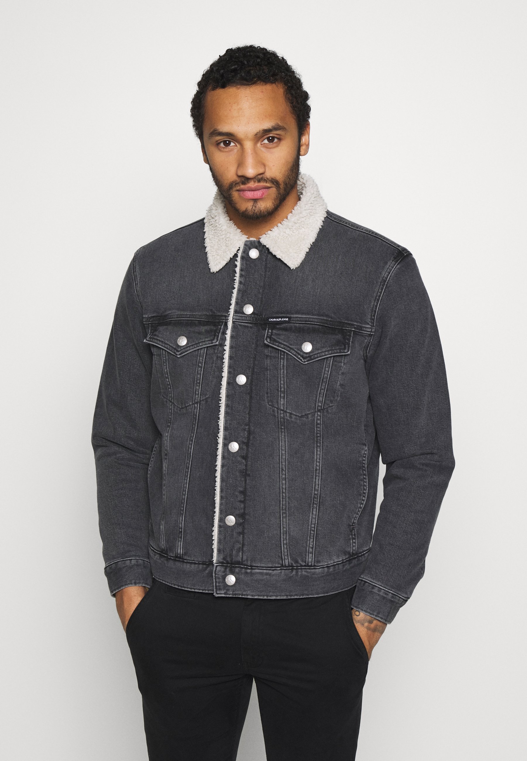 grey jeans with blue denim jacket