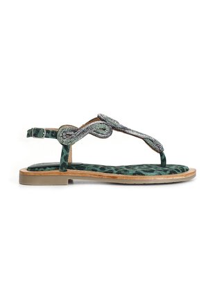 Sándal de estampado de leopardo verde con suela plana, adornado con una correa de cuentas trenzadas y un hebilla en el tobillo ajustable para un mejor ajuste.