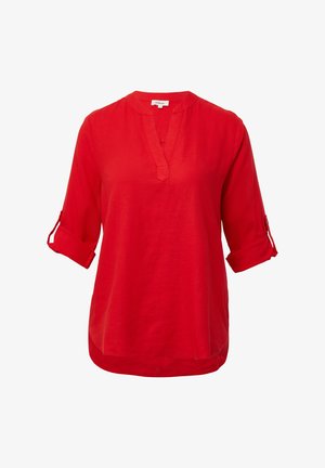 Red linen shirt with a V-neckline, roll-up sleeves, and a relaxed fit. Smooth texture and curved hem detail.