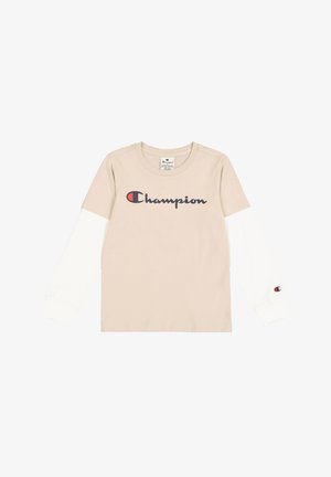 T-shirt beige à manches longues avec des manches blanches, présentant un grand logo 'Champion' bleu marine sur le devant et un petit logo sur la manche.