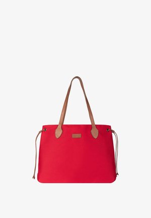 Red tote bag with brown leather handles and side drawstrings, featuring a small rectangular logo patch on the front.