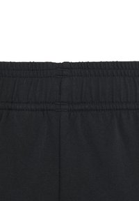 Cintura elástica negra, tejido texturizado, acabado suave, costuras cosidas; diseño minimalista sin marcas o patrones visibles.