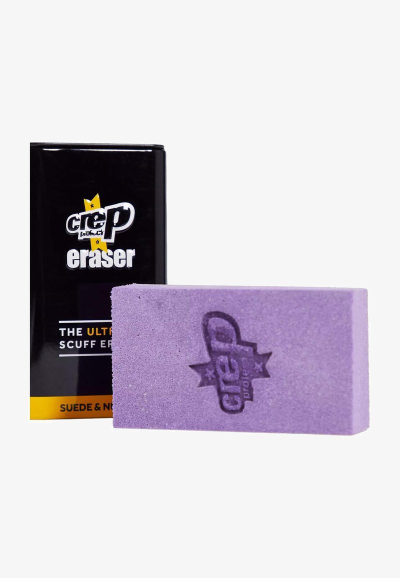 Borrador morado con superficie texturada y logo grabado. Empaquetado en una caja negra con acentos amarillos y texto blanco.