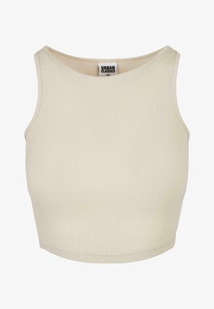 Beige ribbet crop topp med rund halslinning og ermeløs design. Har en enkel tekstur og en diskret merkevarelabel inni halsen.