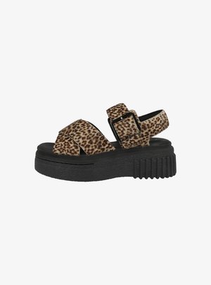 Sandales à plateforme en imprimé léopard avec une semelle en caoutchouc noir et une sangle à boucle. Dispose d'un design croisé avec un tissu texturé.
