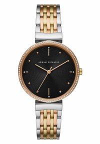 Reloj de metal en tonos dorado y plateado con un dial texturizado negro, acentos en oro rosado y embellishments de cristal alrededor del bisel.