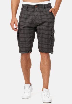 Black plaid cargo shorts with side pockets and a button closure, made from lightweight fabric, featuring a relaxed fit and knee-length design.