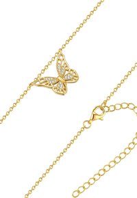 Guld sommerfugl vedhæng halskæde med delikat gitterdesign, prydet med klare krystaller. Kæden har en svirvelklips og justerbar længde.
