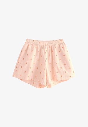 Shorts rose clair avec un waistband élastique, en tissu texturé et ornés de petits motifs de fruits orange et jaune dispersés.