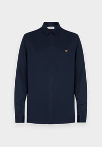 Marineblauw shirt met lange mouwen gemaakt van gladde stof, met een button-down kraag, zwarte knopen en een klein gouden vogel-logo op de borst.