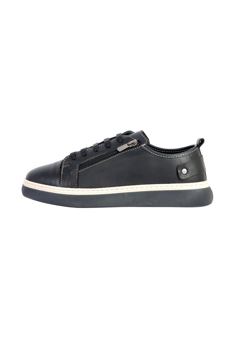 Black leather sneaker with lace-up design, side zipper detail, and white stitching. Features a thick rubber sole and a rounded toe.