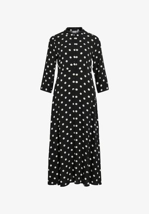 Zwarte jurk met lange mouwen en witte stippen, met een knoopsluiting aan de voorkant en een kraag, gemaakt van een zachte, vloeiende stof.