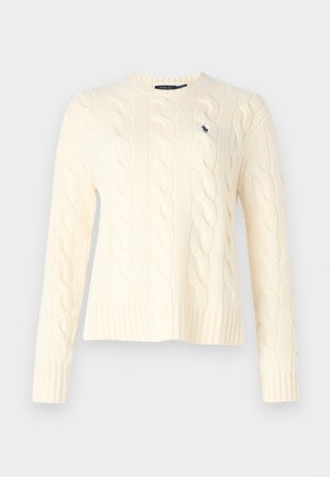 Maglione avorio a trecce con maniche lunghe, polsini e orlo a costine, con un piccolo logo sul lato sinistro del petto. Texture morbida e vestibilità comoda.