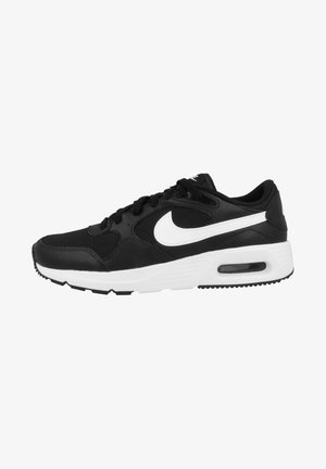 Nike sneakers met een bovenwerk van zwart gaas en leer, een witte Swoosh-logo, een gevoerde kraag en een zwart rubberen zool met zichtbare luchtvering.