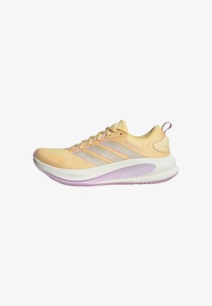 Light yellow running sneakers with a textured upper, three white stripes, purple accents, and a cushioned sole. Features a rounded toe and padded collar.
