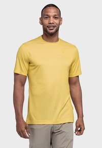 Kurzarmpullover aus gelbem Sportstoff, hergestellt aus atmungsaktivem Material, mit Rundhalsausschnitt und einem kleinen Logoakzent auf der Brust.