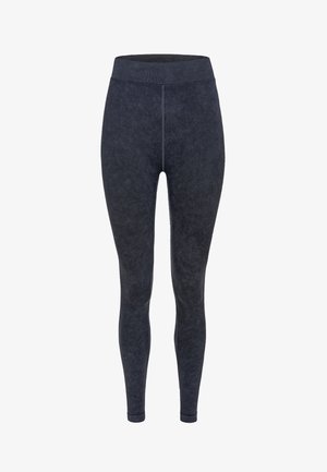 Tummanharmaat legginsit, joissa on pehmeä, harjattu pinta. Korkea, joustava vyötärö. Slim fit -malli, jossa on tasaiset saumat eikä näkyvää metalliosaa.