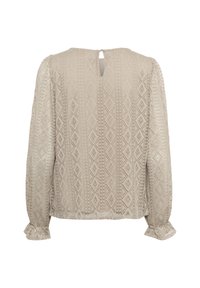 Beige halenka s dlouhým rukávem, která má texturované diamantové vzory, výstřih ve tvaru klíčové dírky na zadní straně a rozšířené manžety pro pohodlný střih.