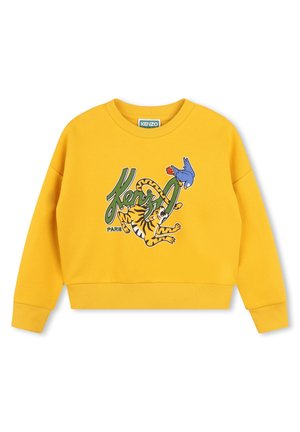 Sweat-shirt jaune court en tissu doux, comportant un imprimé graphique d'un tigre et d'un oiseau avec le texte "KENZO" en vert. Poignets et ourlet côtelés.