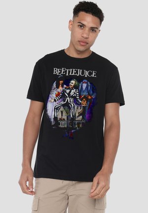 Black cotton t-shirt featuring a colorful Beetlejuice graphic depicting characters and a house, with short sleeves and a crew neckline.