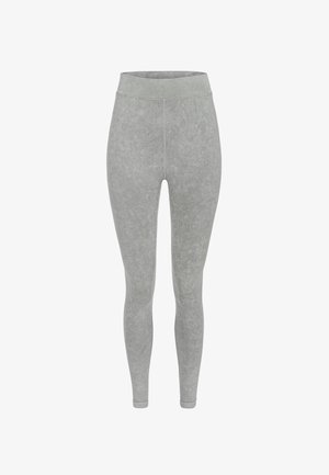 Grå leggings tillverkade av mjukt, texturerat tyg. Har en hög midja och en slank, kroppsnära design. Slät yta utan mönster eller accenter.