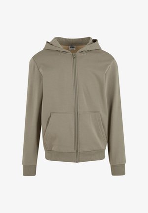 Hanorac cu fermoar crem deschis, confecționat dintr-un material moale, având un fermoar frontal, două buzunare laterale și un glugă cu șnur. Manșete și tiv cu model în dungi.