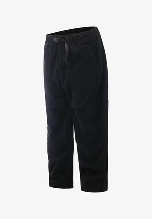 Schwarze Fleece-Hosen mit elastischem Bund, Zugband und seitlichen Taschen; taillierte Passform mit weicher Textur und Nahtdetails.