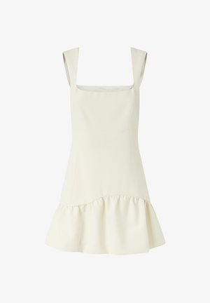 Robe de couleur crème avec un décolleté carré, des bretelles larges et un ourlet évasé. Fabriquée en tissu lisse avec un bord inférieur volanté.