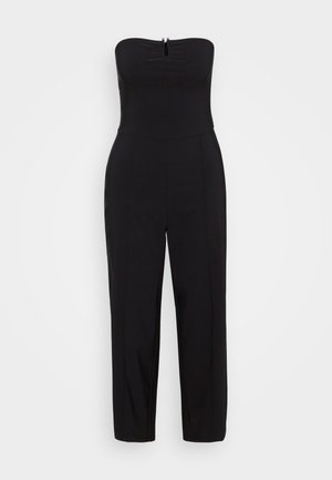 Sort stram jumpsuit uden stropper med et tætsiddende bodice, lynlåsdetalje foran og smalle ben, lavet af et glat, strækbart materiale.