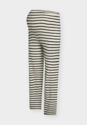 Πλεκτό κολάν σε κρεμ χρώμα με μαύρες οριζόντιες ρίγες. Διαθέτει εφαρμοστή γραμμή και ελαστική μέση.