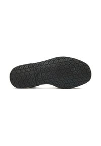 Shoe outsole featuring a black rubber material with a textured grip pattern, including grooved detailing and a visible brand mark.