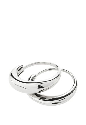 Two shiny silver hoop earrings with a smooth, slightly twisted design on a white background.