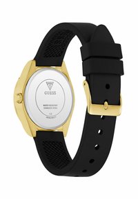 Czarny zegarek na silikonowym pasku z złotą stalową kopertą. Okrąła tarcza z gładkim białym cyferblatem i szczegółowym tyłem. Wodoodporna funkcja.