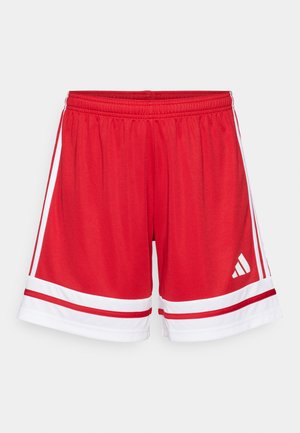 Piros sportberkek elasztikus derékpánttal, fehér oldalsávokkal és fehér díszítéssel az alján. Az Adidas logó fehér színben található rajta.