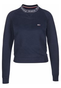 Felpa blu navy in cotone; presenta un collo alto con dettagli a righe rosse e bianche e un piccolo logo sul petto. Polsini a costine.