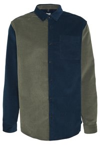 Corduroy-paita, jossa vihreitä ja tummansinisiä osia, napillinen kaulus, pitkät hihat ja rintatasku tummansinisen puolella. Kankaan pinta on teksturoitu.