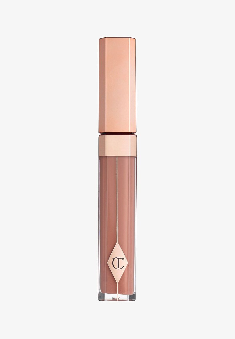 Nude Flüssiglippenstift in einem transparenten Tube mit einem goldenen und roségoldenen sechseckigen Deckel, der ein diamantförmiges Logo auf der Vorderseite zeigt.