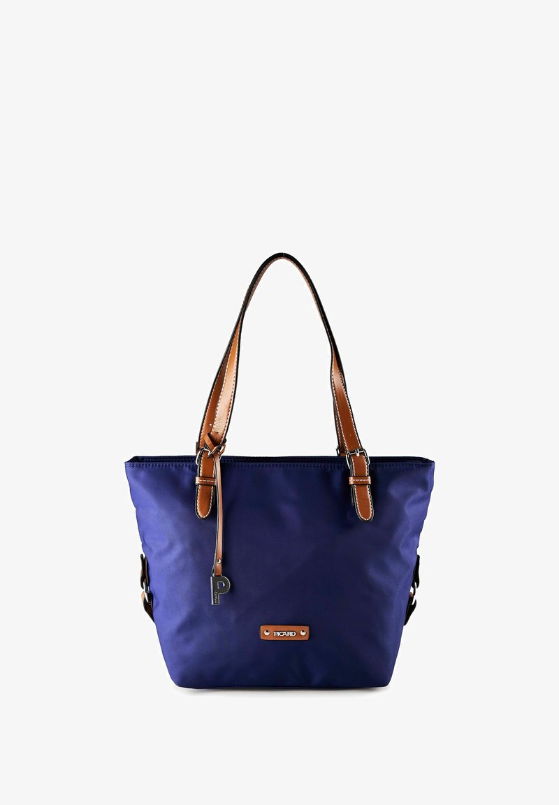 Sac cabas bleu marine avec des anses en cuir marron, des accents de boucles en argent et une petite plaque métallique portant l'inscription "Picard" sur le devant.