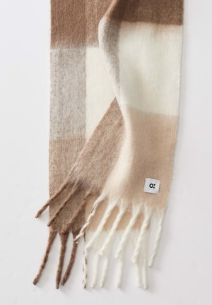 Wool scarf featuring a check pattern with shades of brown, beige, and cream. Fringed ends with a small white logo tag.