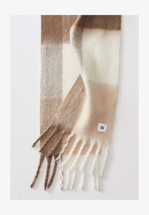 Wool scarf featuring a check pattern with shades of brown, beige, and cream. Fringed ends with a small white logo tag.