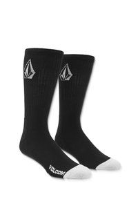 Chaussettes noires côtelées avec un logo blanc sur le dessus et un orteil blanc. Fabriquées en tissu avec une texture lisse. Nom de la marque visible.