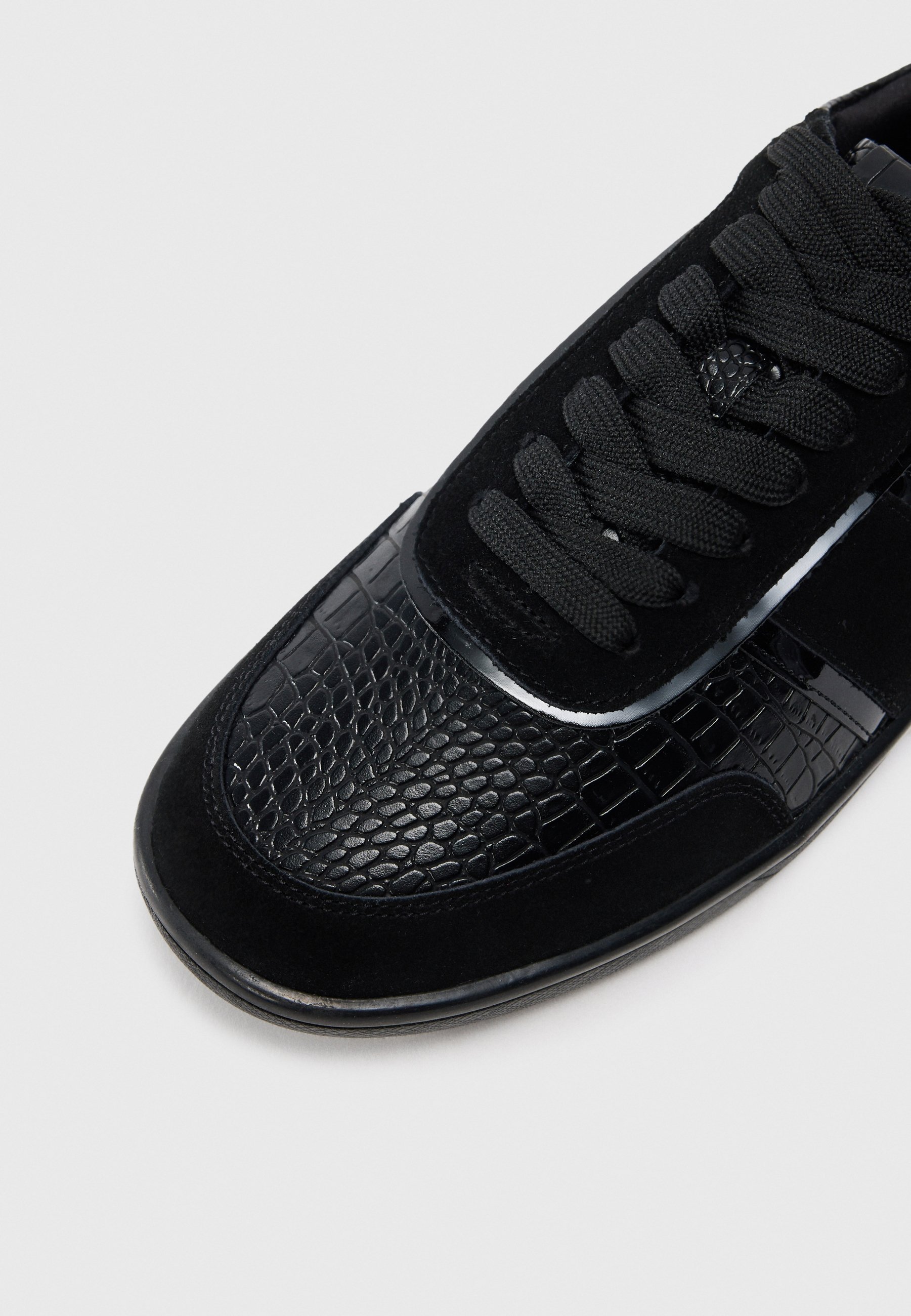 black uptown sneakers